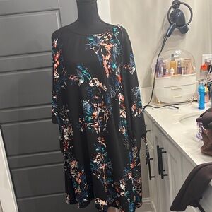 EUC dress by EVRI. Slip over the head. It has a button in the back at the neck.